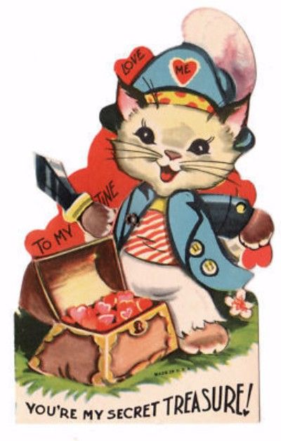 Cartoon cat standing in front of a treasure chest wears a pirate costume with the words "LOVE ME" on his cap. Caption reads "To my Valentine You're my Secret Treasure!"