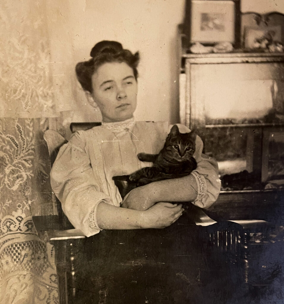 Victorian woman holding a cat, vintage cat photo