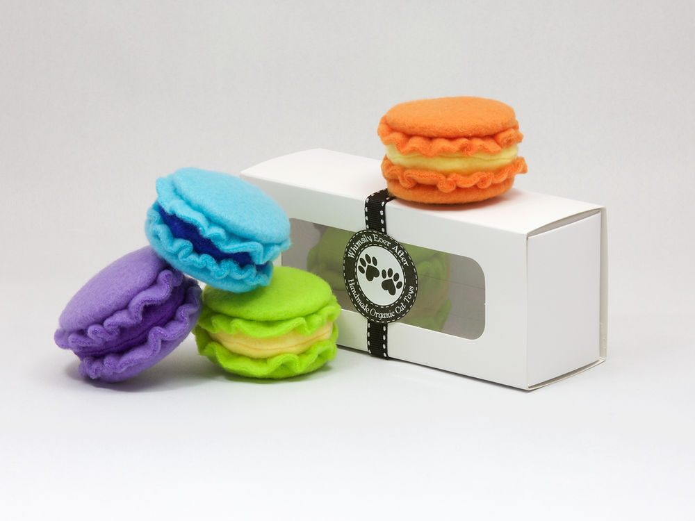 Photo of macaron-shaped cat toys in orange, purple, blue and green