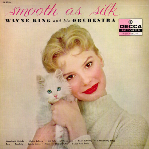 Blonde woman cuddles a white kitten on the cover of Smooth as Silk Wayne King and his Orchestra